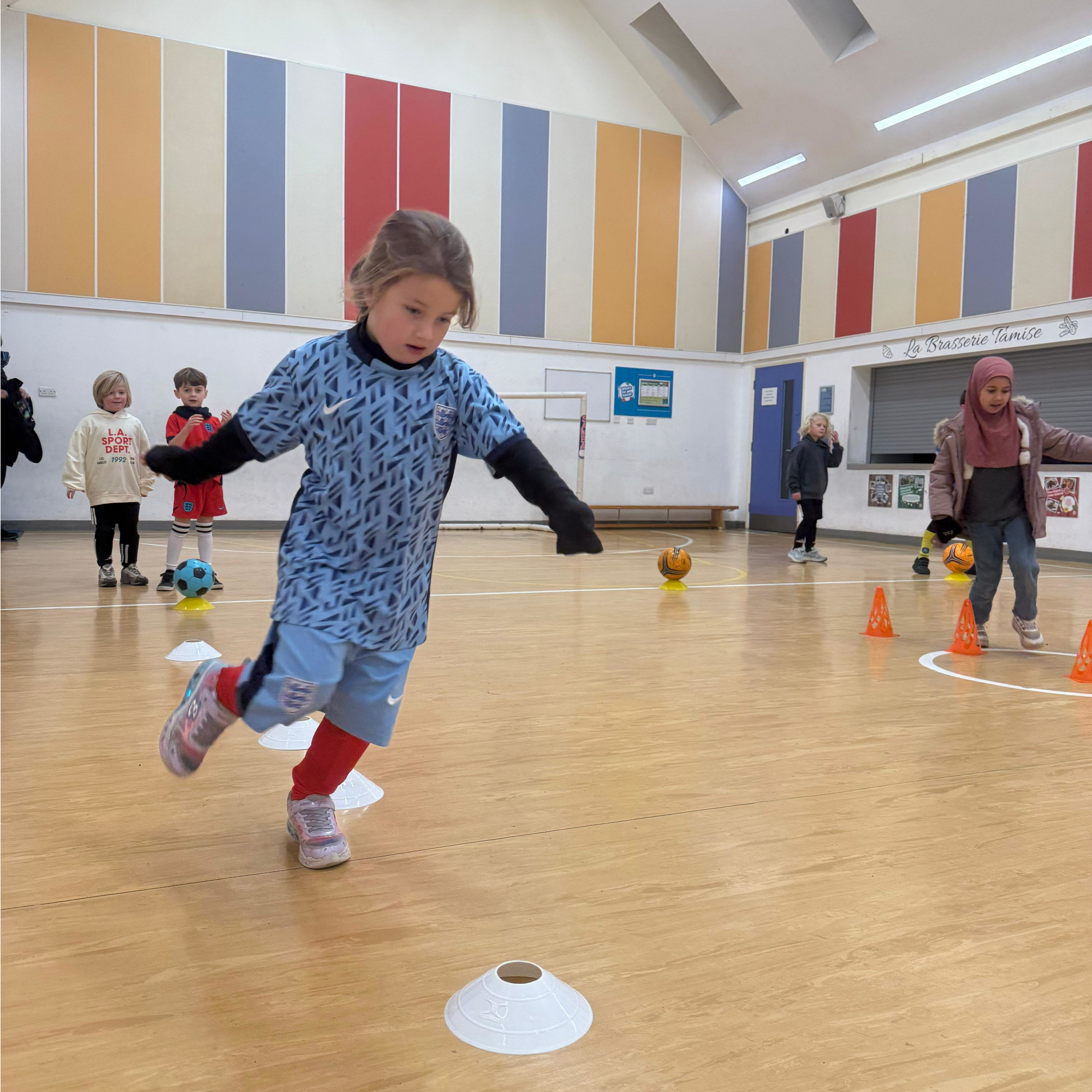 A diverse group of children warming up together
