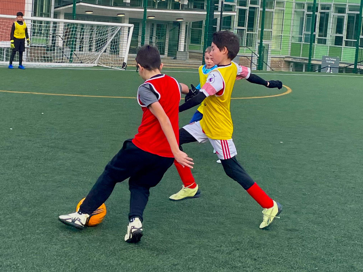 Coach running a focused private football session